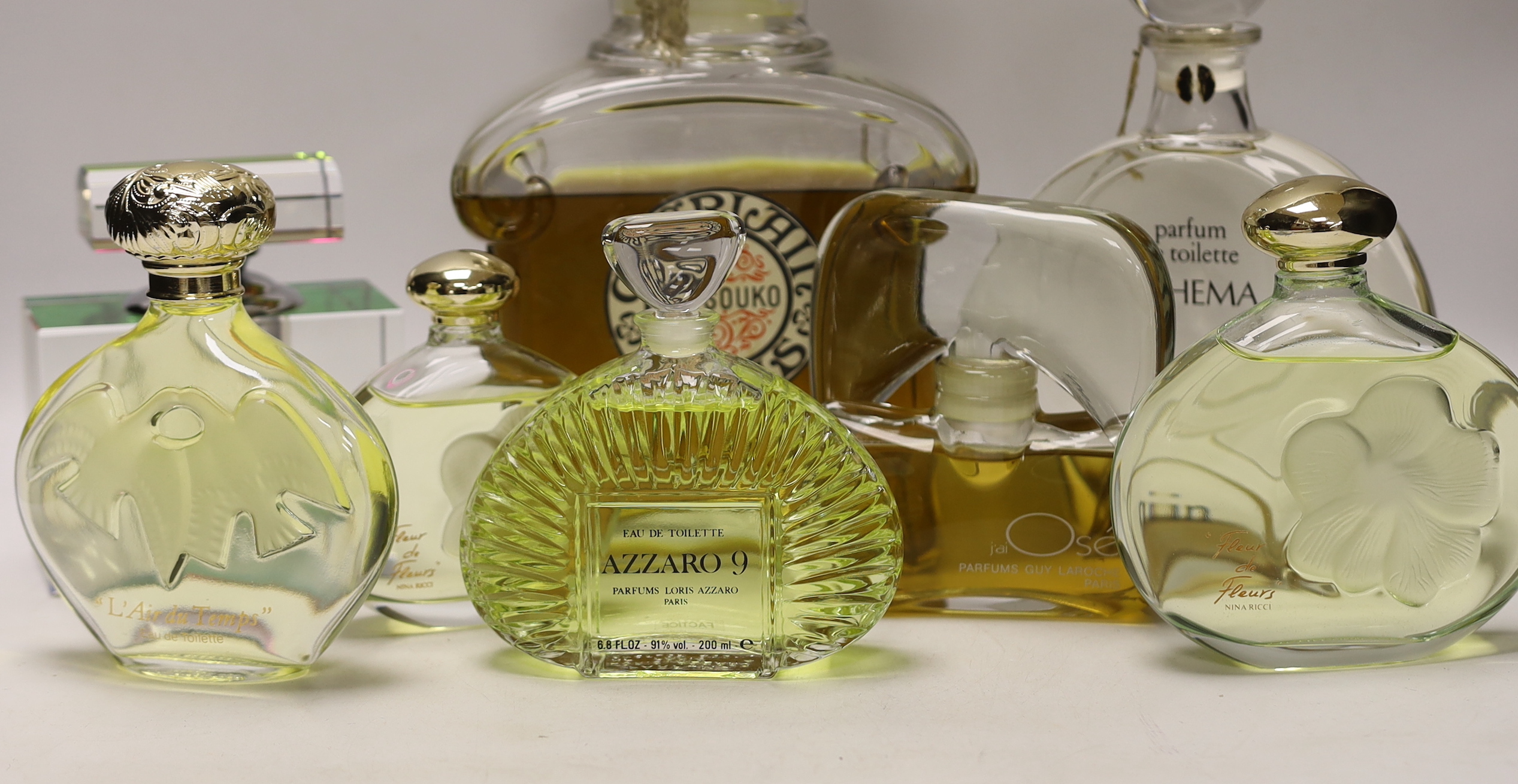 A collection of seventeen glass bottled perfumes; Guerlain Paris, Guy Laroche, Loris Azzaro, Van Cleef & Arpels, etc.